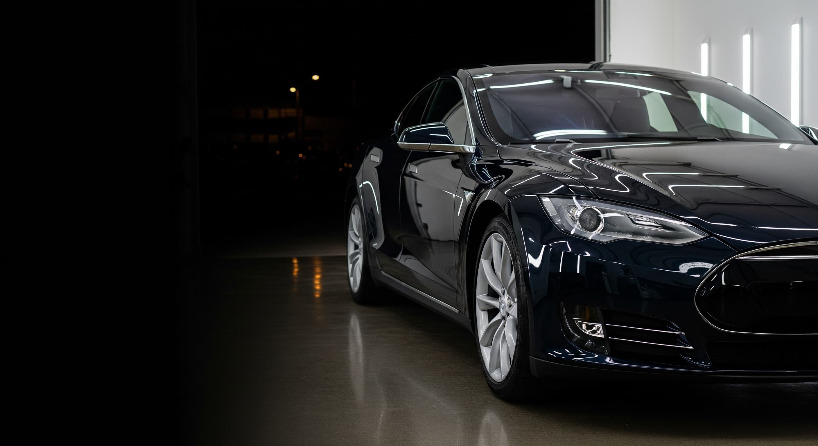 Tinted Tesla photographed inside the Tint N Glass service bay