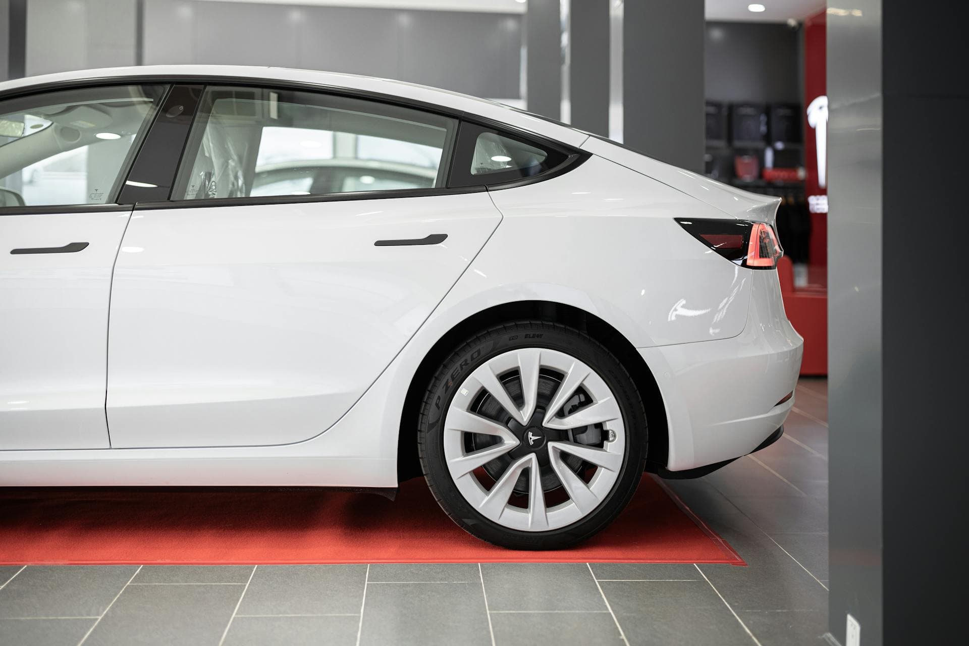 Side-profile finish showing the type of smooth, even glass look Tesla owners usually want.